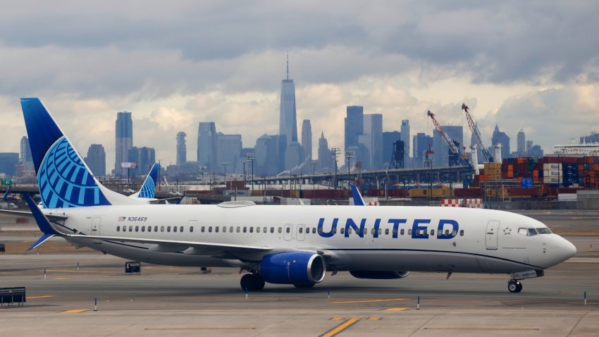 NEWARK, NJ – JANUARY 27: A United Airlines airplane proceeds to a gate at Newark Liberty International Airport ain front of the skyline of lower Manhattan and One World Trade Center in New York City on January 27, 2024, in Newark, New Jersey.