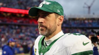 File Photo: Aaron Rodgers walks off the field after a game against the Buffalo Bills at Highmark Stadium on December 29, 2024 in Orchard Park, New York. The Bills defeated the Jets 40-14.