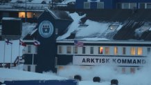 PRODUCTION - 05 February 2025, Greenland, Nuuk: Flags of the Faroe Islands, Denmark and Greenland (from left) fly in front of the headquarters of the Arctic Command next to a US flag. The building is also home to the US consulate in Greenland, which reopened in 2020. US President Trump's desires have suddenly brought remote Greenland to the attention of the global public. Photo: Steffen Trumpf/dpa (Photo by Steffen Trumpf/picture alliance via Getty Images)