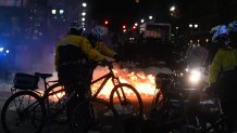 Police officers take security measures as Philadelphia Eagles fans set fires during celebrations of the Philadelphia Eagles' win in Philadelphia, Pennsylvania, United States on February 10, 2025. (Photo by Kyle Mazza/Anadolu via Getty Images)