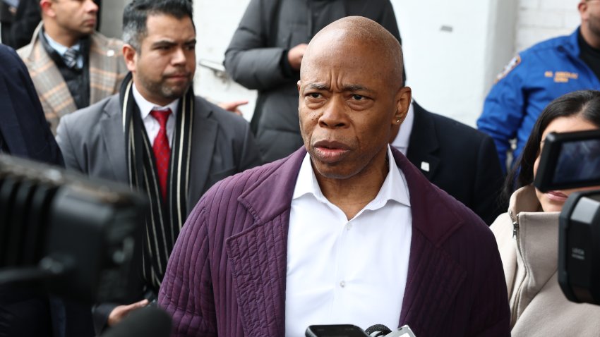 NEW YORK, NEW YORK – FEBRUARY 12: New York City Mayor Eric Adams speaks with members of the media as he arrives for an Adult Town Hall at Sunnyside Community Services Older Adult Center on February 12, 2025 in the Queens borough of New York City. Adams held a town hall to discuss the accomplishments of his administration and listened to questions and concerns from community members a day after the Justice Department dropped his federal bribery and corruption charges. The mayor is scheduled to meet President Donald Trump’s border czar Tom Homan on Thursday.  (Photo by Michael M. Santiago/Getty Images)