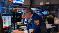 Traders work on the floor of the New York Stock Exchange (NYSE) on March 05, 2025, in New York City. F