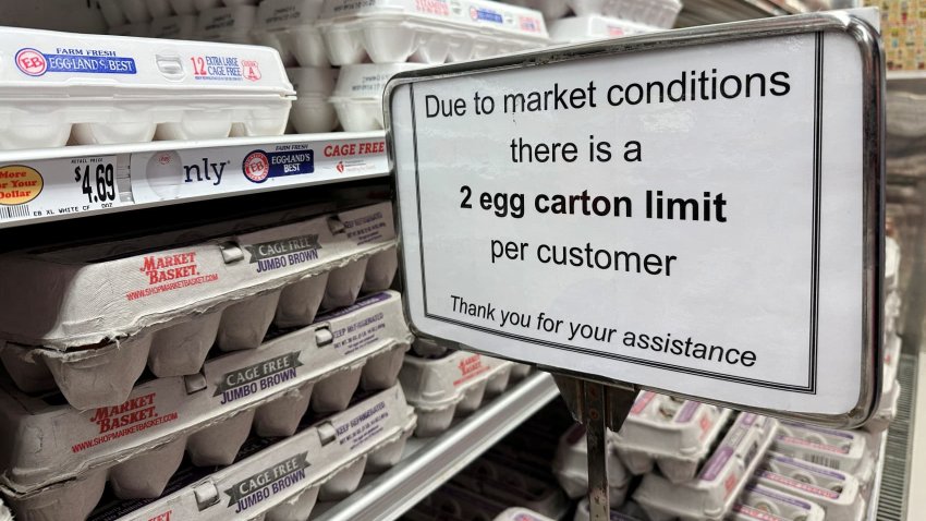 Signs limit the number of cartons of eggs a customer can purchase at a grocery store in Gloucester, Massachusetts, U.S., March 8, 2025. 