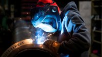 FILE PHOTO: A worker welds a steel tube at HCC, a company that uses parts to make combines, at the factory in Mendota, Illinois, U.S., February 21, 2025. 