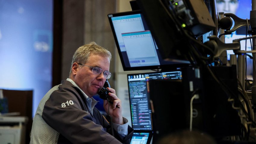 A trader works at the New York Stock Exchange (NYSE) in New York City, U.S., March 24, 2025. 