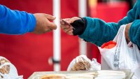 A shopper pays with a credit card at the farmer’s market in San Francisco, California, US, on Thursday, March 27, 2025. 