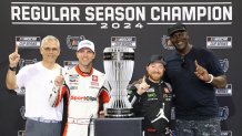 Michael Jordan poses with his NASCAR team