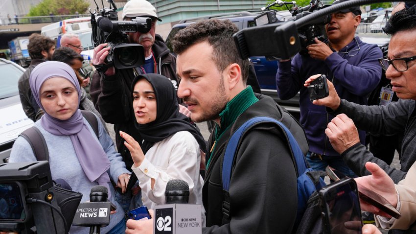 FILE - Members of the Columbia University Apartheid Divest group, including Sueda Polat, second from left, and Mahmoud Khalil, center, are surrounded by members of the media outside the Columbia University campus, Tuesday, April 30, 2024, in New York. (AP Photo/Mary Altaffer, File)