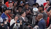 St. John's head coach Rick Pitino admires the tournment trophy after an NCAA college basketball game against Creighton in the championship of the Big East Conference tournament Saturday, March 15, 2025, in New York. (AP Photo/Frank Franklin II)