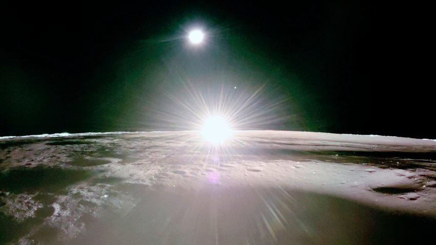 This image provided by NASA/Firefly Aerospace, Tuesday, March 18, 2025, shows the sun setting on the moon, with Earth and Venus in the distance. (NASA/Firefly Aerospace via AP)