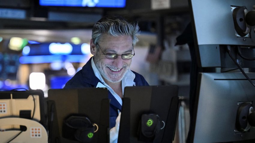 A trader works on the floor of the New York Stock Exchange during afternoon trading on April 9, 2025 in New York. 