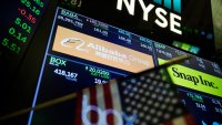 A monitor displays Alibaba Group Holding Ltd. signage on the floor of the New York Stock Exchange (NYSE) in New York, U.S., on Wednesday, Jan. 30, 2019.