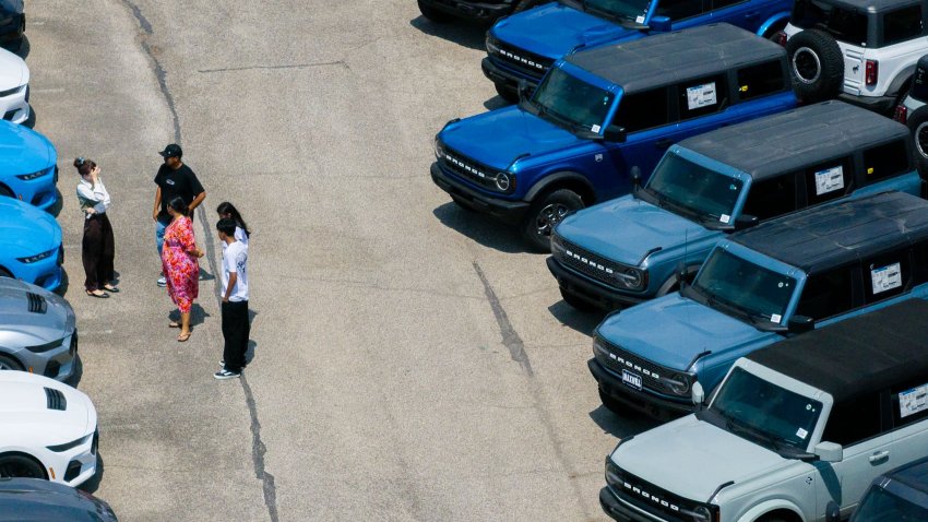 In an aerial view, Ford Broncos are seen for sale on a lot at a dealership on April 18, 2025 in Austin, Texas.