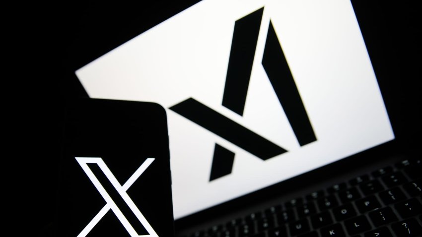 The X logo appears on a phone, and the xAI logo is displayed on a laptop in Krakow, Poland, on April 1, 2025. (Photo by Klaudia Radecka/NurPhoto via Getty Images)