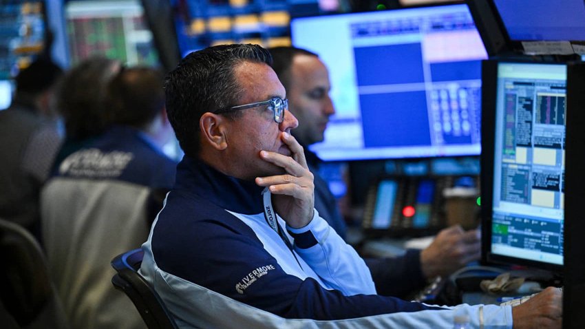 Traders work on the floor of the  New York Stock Exchange (NYSE) on April 29, 2025 in New York City.