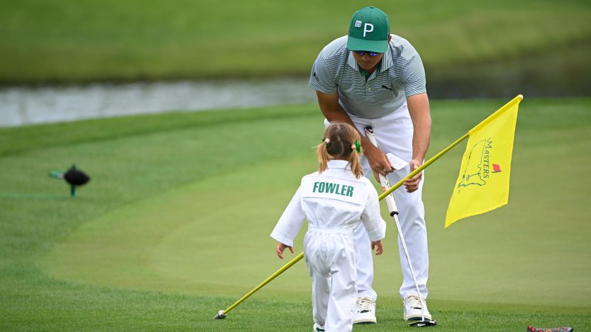 Rickie Fowler with his daughter, Maya, during the Par-3 Contest