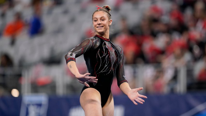 FILE - Utah's Grace McCallum completes on the floor exercise during the NCAA women's gymnastics championships, April 14, 2022, in Fort Worth, Texas.