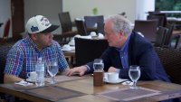 In this photo released by Senator Van Hollen's press office, Hollen, right, speaks with Kilmar Abrego Garcia,