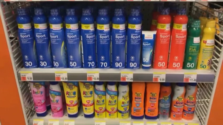A row of sunscreens on a store shelf.