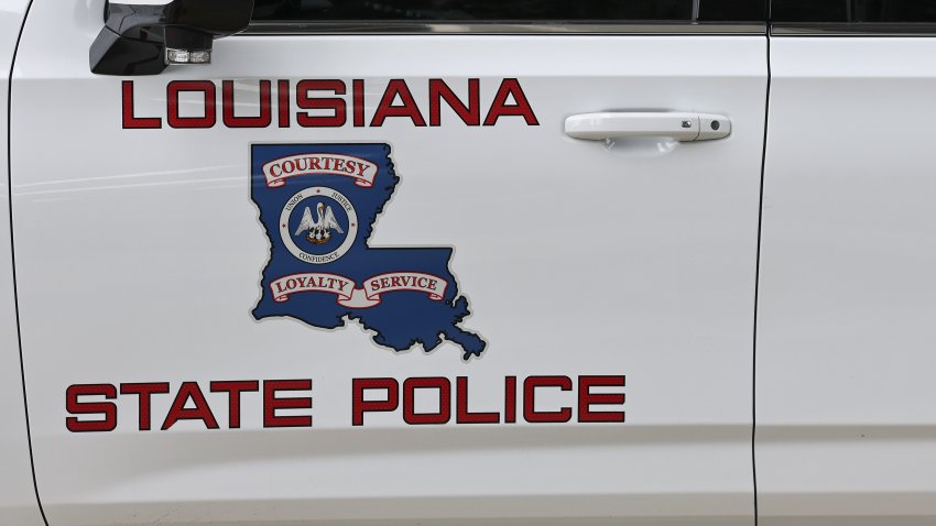 A Louisiana State Police vehicle parked on the street ahead