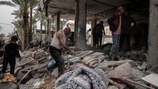 Search and rescue operations are conducted in the areas targeted by Israeli forces in Deir Al Balah, Gaza