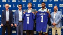 Apr 25, 2025; East Rutherford, NJ, US; New York Giants president John Mara (far left), general manager Joe Schoen (left), Jaxson Dart, Abdul Carter, and head coach Brian Daboll (right) pose for photos prior to the start of the press conference to introduce the Giants first round draft picks.  Mandatory Credit: Thomas Salus-Imagn Images