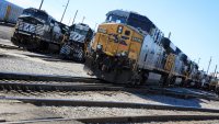 Norfolk Souther Rail and a CSX train sit at the Norfolk Southern Bellevue Terminal in Bellevue, Ohio.