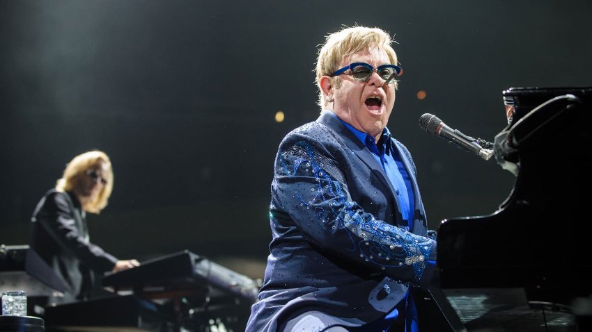 Sir Elton John (right) performs at the Verizon Center in Washington, D.C.