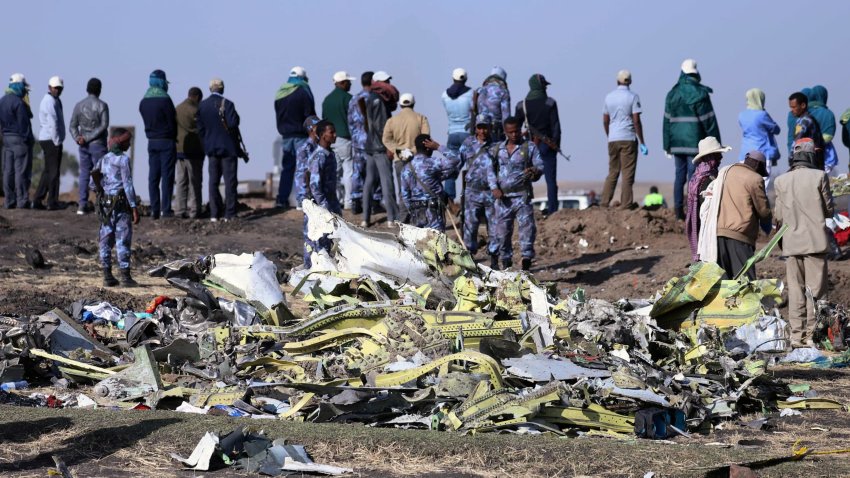 Ethiopian Federal policemen stand at the scene of the Ethiopian Airlines Flight ET 302 plane crash, near the town of Bishoftu, southeast of Addis Ababa, Ethiopia March 11, 2019.