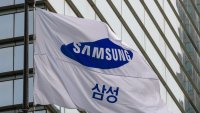 A Samsung Group flag flutters in front of the company’s Seocho building in Seoul. 