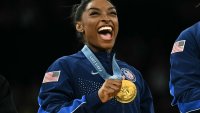 Simone Biles poses with the gold medal during the podium ceremony at the 2024 Paris Olympic Games at the Bercy Arena in Paris on July 30, 2024.