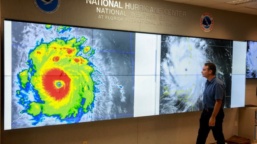 John Cangialosi, Senior Hurricane Specialist at the National Hurricane Center, inspects a satellite image of Hurricane Beryl, the first hurricane of the 2024 season, at the National Hurricane Center on July 1, 2024 in Miami, Florida.
