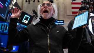 A trader reacts as he works on the floor of the New York Stock Exchange during morning trading on April 15, 2025 in New York City.