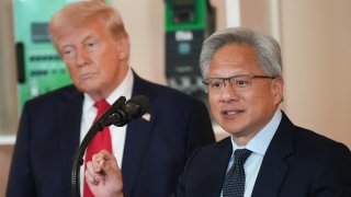 U.S. President Donald Trump (L) listens as Nvidia CEO Jensen Huang speaks in the Cross Hall of the White House during an event on “Investing in America” on April 30, 2025 in Washington, DC.