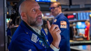 Traders work on the floor of the New York Stock Exchange (NYSE) on May 19, 2025 in New York City.