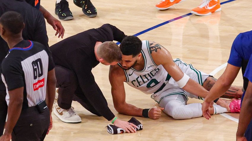 Jayson tatum on the floor after injury