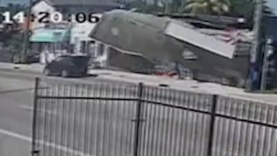 Video shows partial roof collapse in Miami narrowly miss vehicle