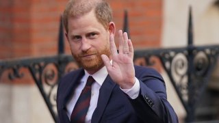 Prince Harry waves as he leaves the Royal Courts of Justice in London, Wednesday, April 9, 2025.