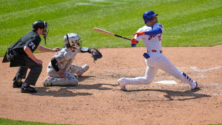 New York Mets’ Juan Soto, right, watches his solo home run during the eighth inning of a baseball game against the Arizona Diamondbacks, Thursday, May 1, 2025, in New York. (AP Photo/Seth Wenig)