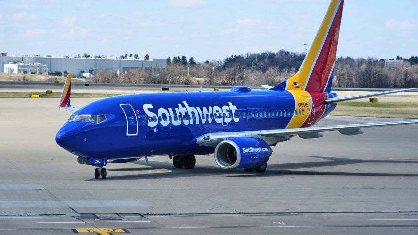 FILE – A Southwest Airlines plane pull into a gate at Pittsburgh International Airport in Imperial, Pa., Thursday, March 27, 2025. (AP Photo/Gene J. Puskar, File)