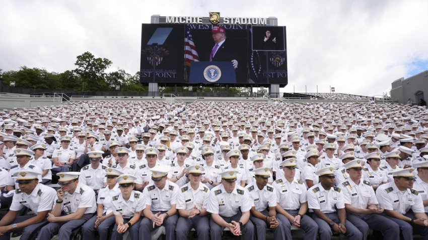 Cadets listen as President Donald Trump, seen on screen, speaks to United States Military Academy graduating cadets during commencement ceremonies in West Point, N.Y., Saturday, May 24, 2025. (AP Photo/Manuel Balce Ceneta)