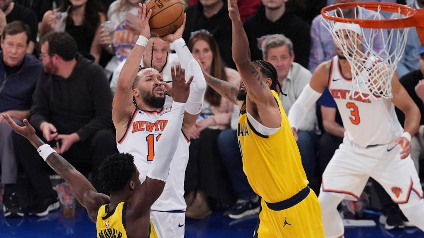 New York Knicks guard Jalen Brunson (11) puts up a shot against Indiana Pacers forward Obi Toppin (1) and guard Bennedict Mathurin (00) during the third quarter of Game 5 of the NBA basketball Eastern Conference final, Thursday, May 29, 2025, in New York.