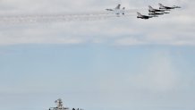 After the entire weekend of shows were canceled due to heavy storms, an improvised Memorial Day airshow was held at New York's Jones Beach, featuring World War 2 aircraft from the American Airpower Museum and the U.S. Air Force Thunderbirds.
Here, a F-16 falcons from the U.S. Air Force Thunderbirds fly over the Coast Guard cutter Bruckenthal on 31 May 2021 in New York, US. (Photo by B.A. Van Sise/NurPhoto via Getty Images)