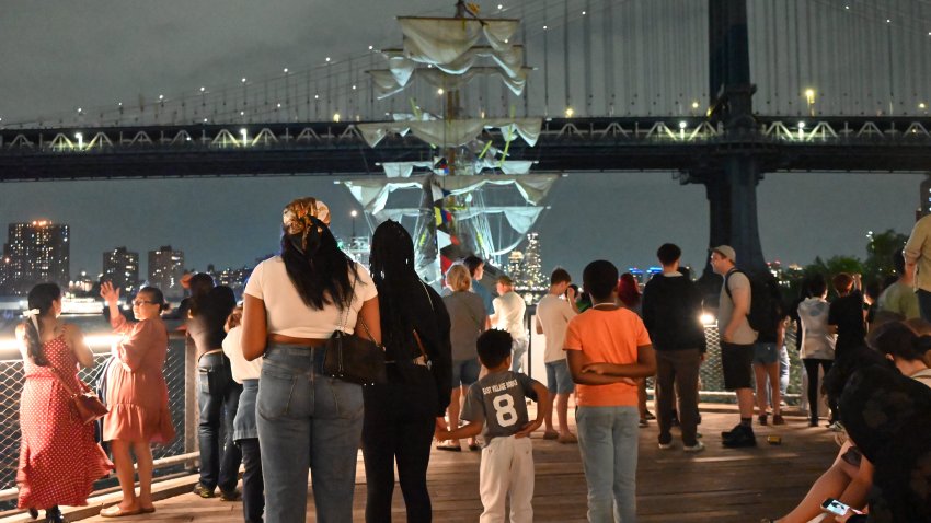 NEW YORK CITY, USA – MAY 17: People watch the Mexican navy tall ship being tended by the authorities after it crashes into the Brooklyn Bridge in Manhattan, New York, USA on May 18, 2025. The ship, which has a crew of 277, collided with the bridge’s road deck and left multiple crew members seriously injured, and two people passed away, according officials and sources. (Photo by Kyle Mazza/Anadolu via Getty Images)