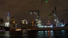 Emergency personnel respond after the Mexican Navy's tall ship Cuauhtemoc collided with the Brooklyn Bridge in New York City on May 17, 2025. The ship, which had been docked as part of a goodwill tour, struck the underside of the bridge while departing, injuring dozens. Rescue operations were launched as crew members evacuated and emergency boats arrived on scene. (Photo by Madison Swart / Hans Lucas / Hans Lucas via AFP) (Photo by MADISON SWART/Hans Lucas/AFP via Getty Images)