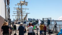 NEW YORK, NEW YORK - MAY 19: Media gather near a  damaged Mexican Navy sailing ship, the Cuauhtémoc, that crashed into the Brooklyn Bridge over the weekend as it sits moored in lower Manhattan on May 19, 2025 in New York City. The collision, which snapped all three of the masts on the ship as it collided with the landmark bridge, killed at least two crew members and injured 19 others. (Photo by Spencer Platt/Getty Images)
