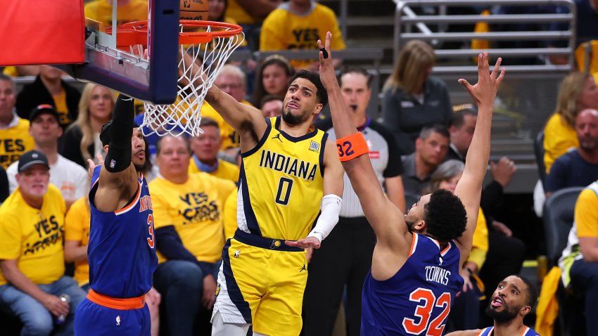 INDIANAPOLIS, INDIANA – MAY 27:  Tyrese Haliburton #0 of the Indiana Pacers attempts a lay up against Karl-Anthony Towns #32 of the New York Knicks during the fourth quarter in Game Four of the Eastern Conference Finals of the 2025 NBA Playoffs at Gainbridge Fieldhouse on May 27, 2025 in Indianapolis, Indiana. NOTE TO USER: User expressly acknowledges and agrees that, by downloading and or using this photograph, User is consenting to the terms and conditions of the Getty Images License Agreement.