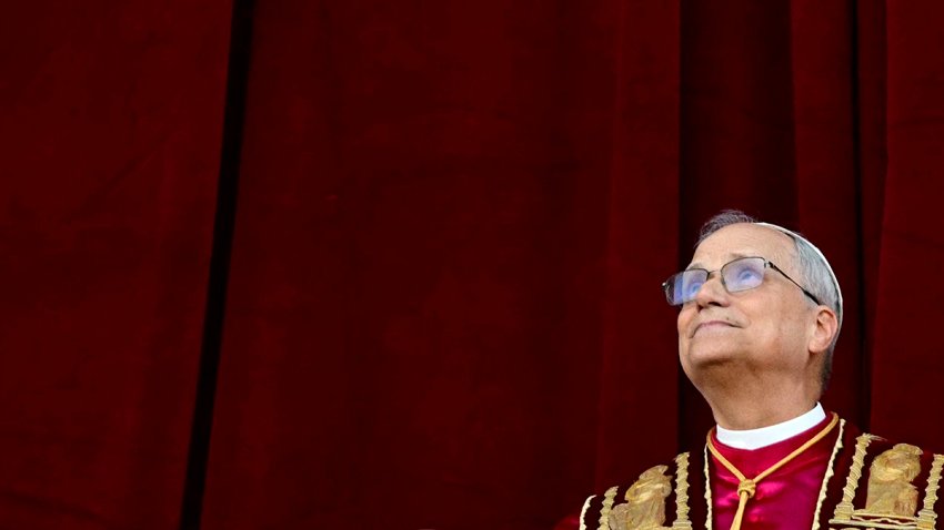 New Pope Leo XIV addresses the crowd from the balcony of St. Peter's Basilica for the first time in The Vatican, on May 8, 2025.