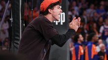 May 12, 2025; New York, New York, USA; Actor Timothee Chalamet cheer while sitting curtsied in the second half during game four of the second round for the 2025 NBA Playoffs between the New York Knicks and the Boston Celtics at Madison Square Garden. Mandatory Credit: Vincent Carchietta-Imagn Images