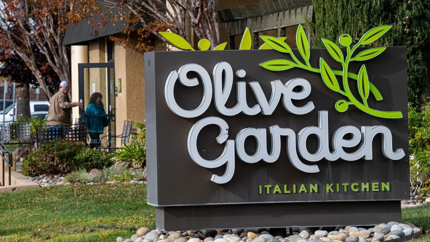 Customers enter an Olive Garden restaurant in Pittsburg, California, US, on Friday, Dec. 9, 2022.